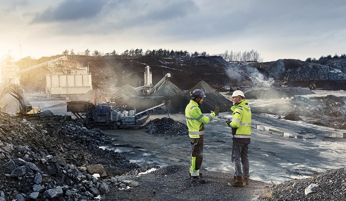 Two workers in rock quarry