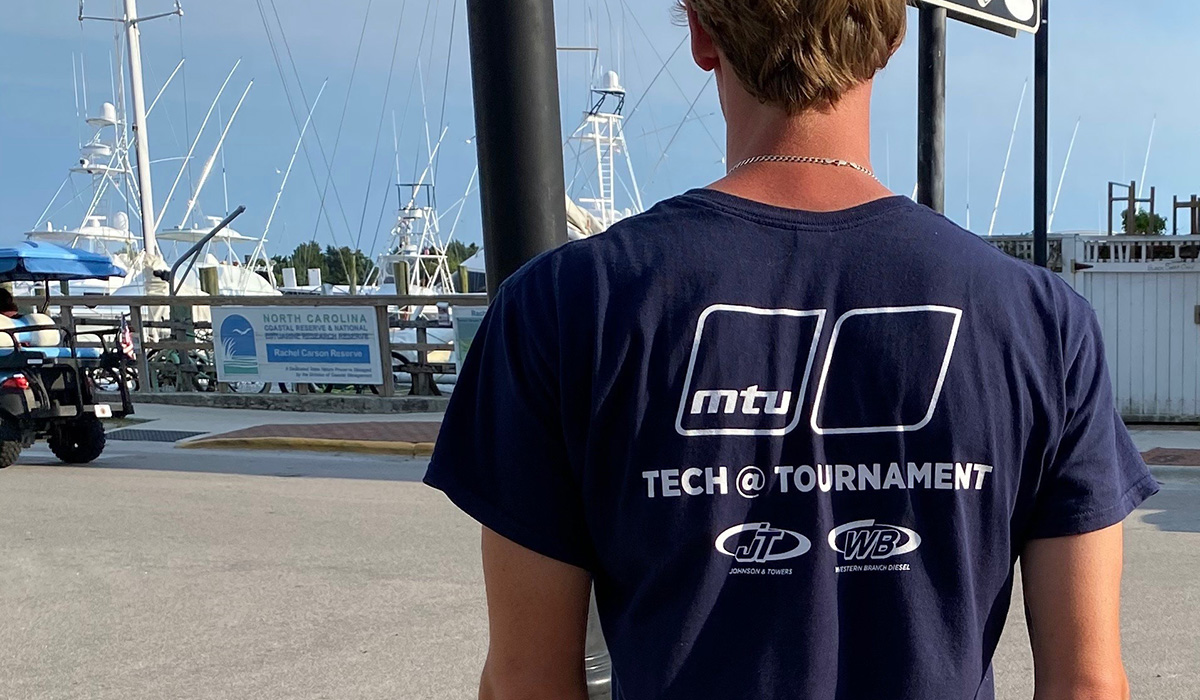 Technician wearing a Tech @ Tournament t-shirt