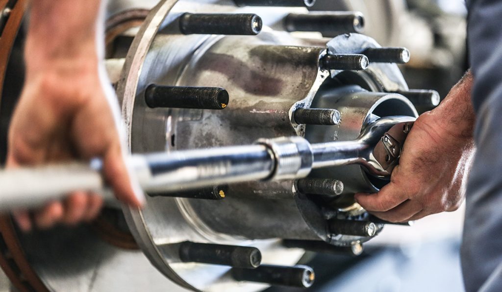 Photo of technician working on truck brake drum