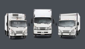 Image of three Isuzu trucks.
