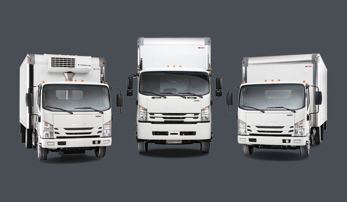 Image of three Isuzu trucks.